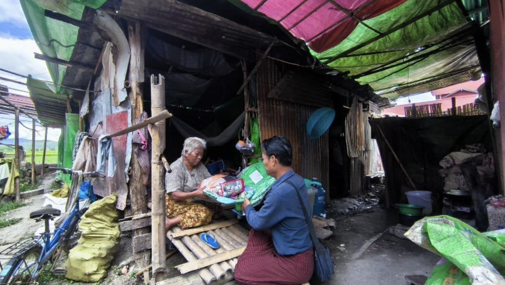 CTER volunteer delivering NFI package directly to an elderly displaced person at their shelter.